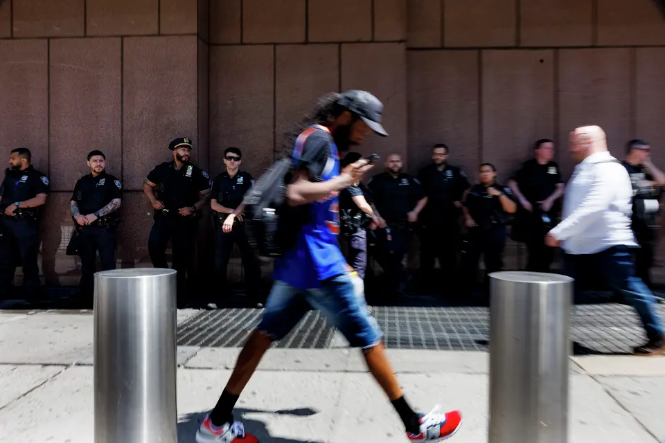 New York police officers stand outside Madison Square Garden hours before Game 3 of the NBA Finals between the New York Knicks and the San Antonio Spurs on Monday, June 8, 2026, in New York. NYPD and the U.S. Secret Service established a large security perimeter, cancelling all public watch parties outside of the arena, after it was announced that President Donald Trump would attend the game.