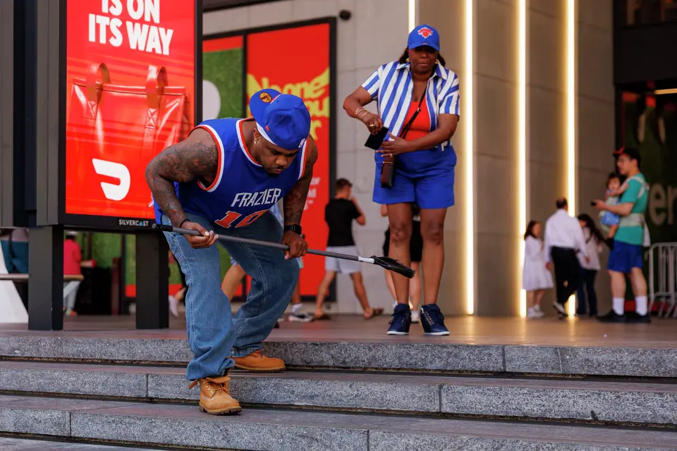 “Knicks in four!,” yells a New York Knicks fan as he sweeps and cleans the steps outside of Madison Square Garden in New York, Monday, June 8, 2026, ahead of Game 3 of the NBA Finals between the San Antonio Spurs and the New York Knicks.