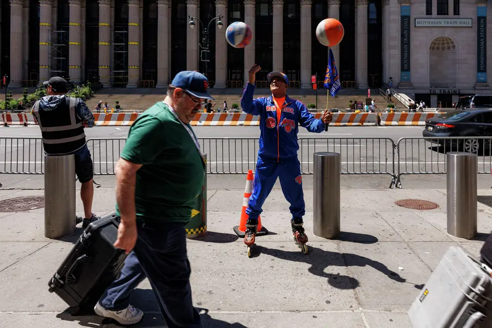 A New York Knicks fan rollerblades outside of Madison Square Garden in New York, Monday, June 8, 2026, hours before Game 3 of the NBA Finals against the New York Knicks. The NYPD and U.S. Secret Service established a large security perimeter, cancelling all public watch parties outside of the arena, after it was announced that President Donald Trump would attend the game.