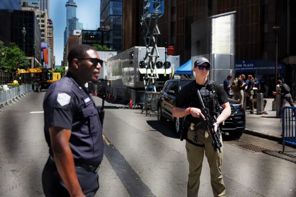 A New York police officer and U.S. Secret Service special agent stand outside Madison Square Garden hours before Game 3 of the NBA Finals between the New York Knicks and the San Antonio Spurs on Monday, June 8, 2026, in New York. NYPD and the U.S. Secret Service established a large security perimeter, cancelling all public watch parties outside of the arena, after it was announced that President Donald Trump would attend the game.
