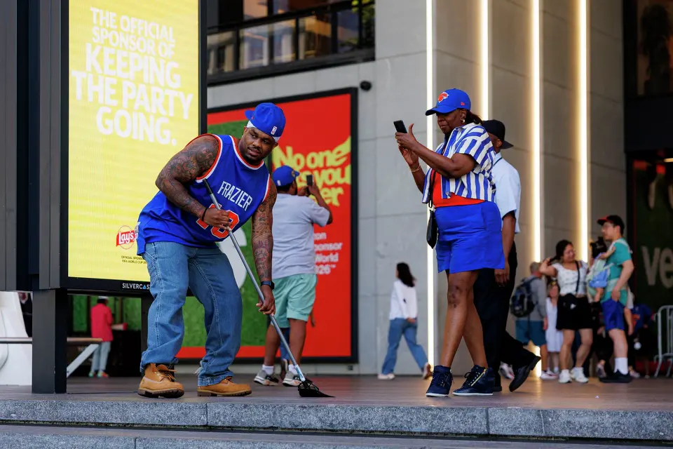 “Knicks in four!,” yells a New York Knicks fan as he sweeps the steps outside of Madison Square Garden in New York, Monday, June 8, 2026, ahead of Game 3 of the NBA Finals between the San Antonio Spurs and the New York Knicks.