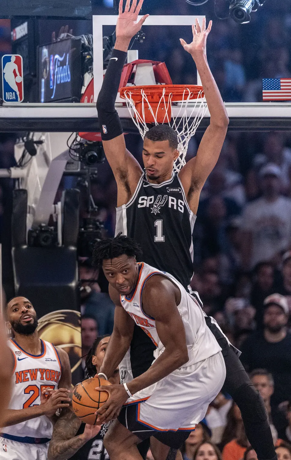 San Antonio Spurs center Victor Wembanyama (1) denies New York Knicks forward Og Anunoby (8) the shot under the basket during the first quarter of the NBA Finals, game three at Madison Square Garden on June 8, 2026.