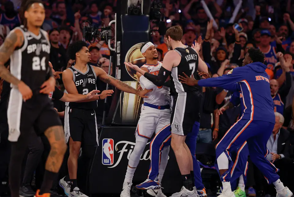 New York Knicks guard Josh Hart (3) has words with San Antonio Spurs center Luke Kornet (7) after hart got knocked to the floor during the first half of game three of the NBA Championship at Madison Square Garden in New York City on Monday, June 8, 2026.