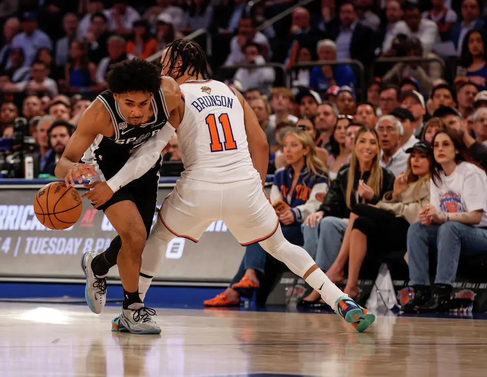 San Antonio Spurs guard Dylan Harper (2) breaks past New York Knicks guard Jalen Brunson (11) during the first quarter of Game 3 of the NBA Finals at Madison Square Garden in New York, Monday, June 8, 2026.