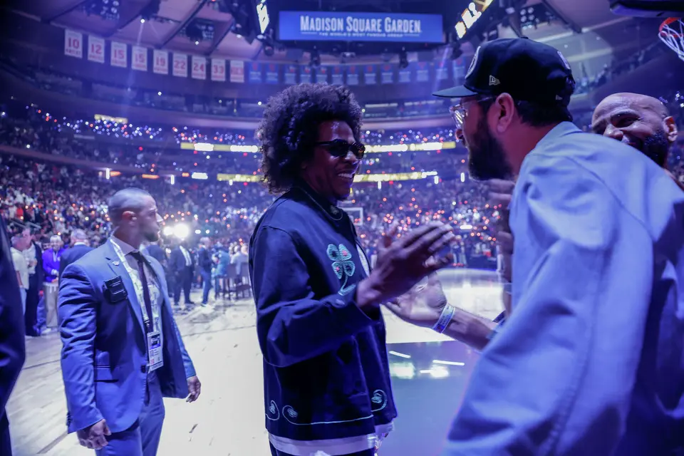 Jay-Z shakes hands with Ray Romano before the start of Game 3 of the NBA Finals at Madison Square Garden in New York, Monday, June 8, 2026.