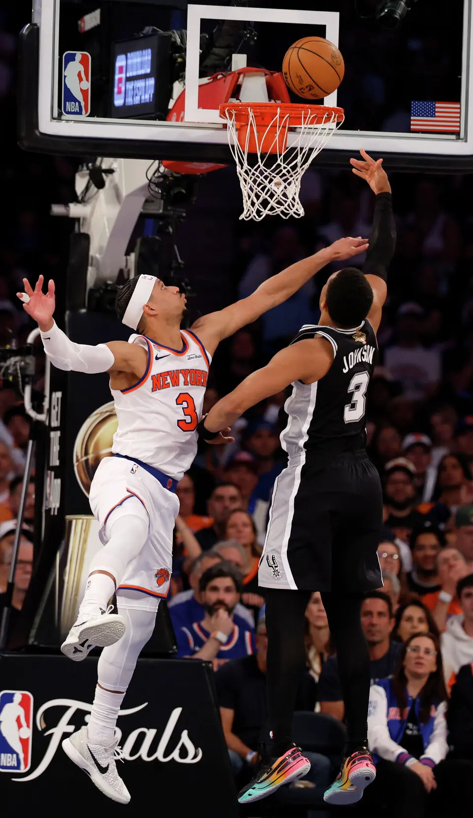 San Antonio Spurs forward Keldon Johnson (3) gets the basket past New York Knicks guard Josh Hart (3) during the third quarter of Game 3 of the NBA Finals at Madison Square Garden in New York, Monday, June 8, 2026.