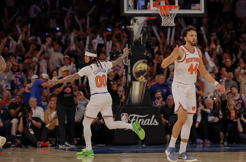 New York Knicks guard Jordan Clarkson (00) flashes the three point sign after making a basket during the third quarter of Game 3 of the NBA Finals at Madison Square Garden in New York, Monday, June 8, 2026.