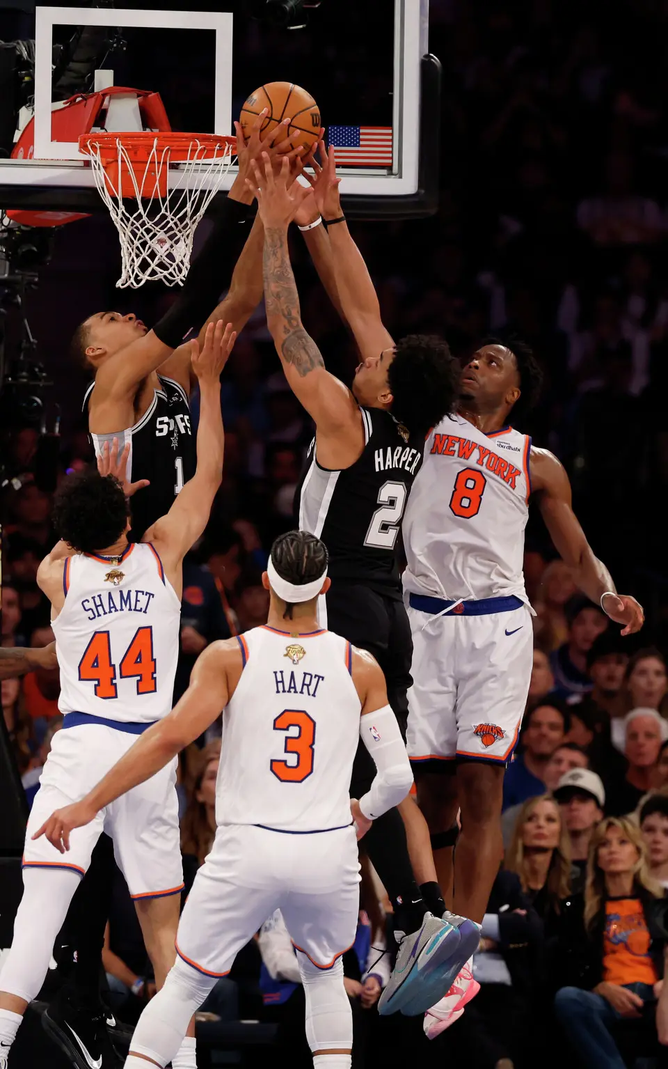San Antonio Spurs guard Dylan Harper (2)and San Antonio Spurs center Victor Wembanyama (1) go for the rebound bucket past Knicks defenders during the third quarter of Game 3 of the NBA Finals at Madison Square Garden in New York, Monday, June 8, 2026.