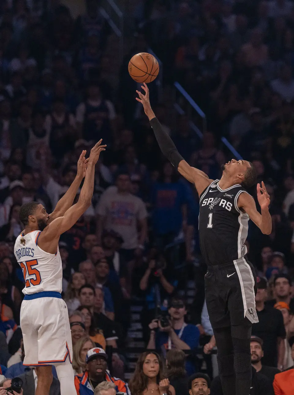 San Antonio Spurs center Victor Wembanyama (1) gets a finger on a shot made by New York Knicks guard Mikal Bridges (25) during the first half of game three of the NBA Championship at Madison Square Garden in New York City on Monday, June 8, 2026.