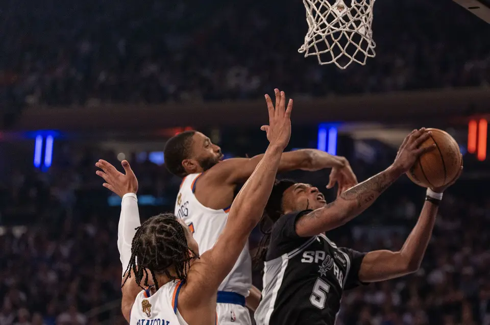San Antonio Spurs guard Stephon Castle (5) gets fouled by New York Knicks guard Mikal Bridges (25) while trying to make a basket during the first half of game three of the NBA Championship at Madison Square Garden in New York City on Monday, June 8, 2026.