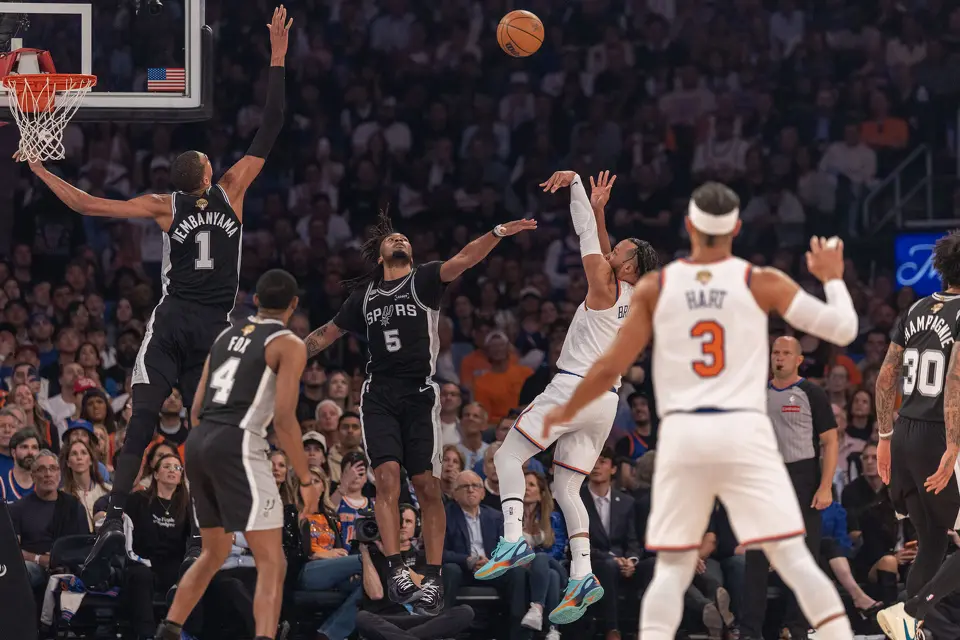 New York Knicks guard Jalen Brunson (11) takes a shot over San Antonio Spurs guard Stephon Castle (5) for two points during the first half of game three of the NBA Championship at Madison Square Garden in New York City on Monday, June 8, 2026.