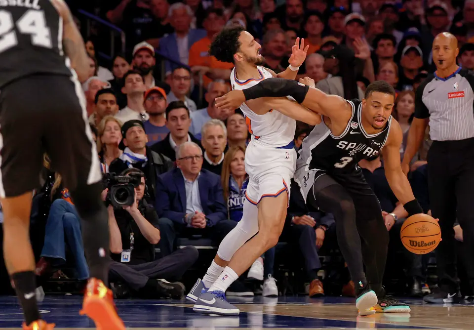 San Antonio Spurs forward Keldon Johnson (3) gets around New York Knicks guard Landry Shamet (44) during the third quarter of Game 3 of the NBA Finals at Madison Square Garden in New York, Monday, June 8, 2026.