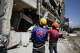 Rescuers inspect a damaged building following an earhtquake in General Santos, Philippines Tuesday, June 9, 2026.