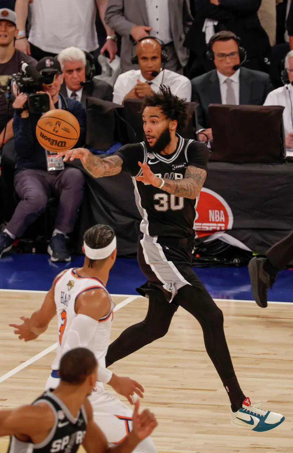 San Antonio Spurs forward Julian Champagnie (30) makes a quick transition pass while running up the court during the fourth quarter of Game 3 of the NBA Finals at Madison Square Garden in New York, Monday, June 8, 2026. The Spurs defeated the Knicks 115-111.