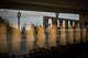 Tourists are reflected in the glass of a museum on the main square of the Monastery of Montserrat near Barcelona, Spain, Friday, June 5, 2026.