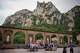 Tourists pose for a photo at the main square of the Monastery of Montserrat near Barcelona, Spain, Friday, June 5, 2026.