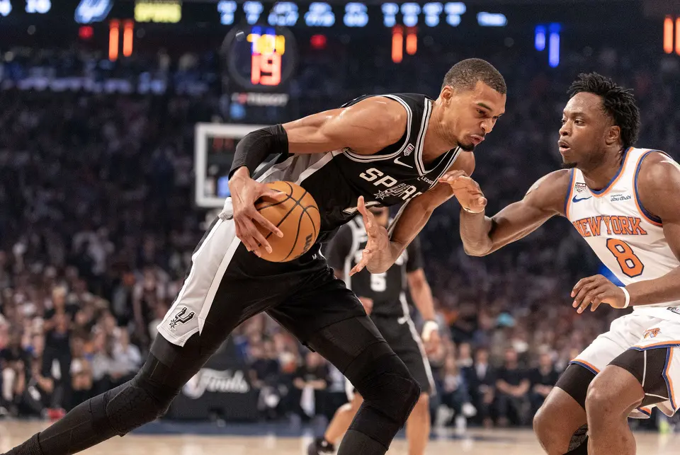 San Antonio Spurs center Victor Wembanyama (1) drives to the basket while being guarded by New York Knicks forward Og Anunoby (8) t during the first quarter of the NBA Finals, game three at Madison Square Garden on June 8, 2026.