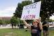 Lori Arnold of North Texas holds a sign that reads “JUSTICE 4 AUSTIN” outside of the Collin County Courthouse as closing arguments are scheduled to start in Karmelo Anthony’s murder trial in McKinney, TX, Tuesday, June 9, 2026. Anthony is accused of killing 17-year-old Austin Metcalf last April at a Frisco track meet at David Kuykendall Stadium.