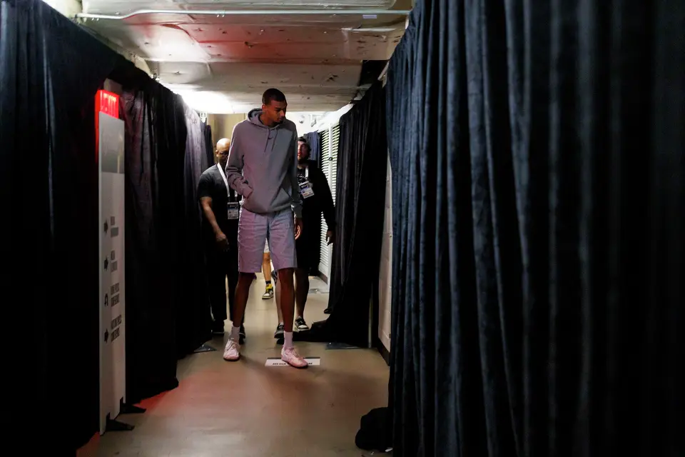 San Antonio Spurs center Victor Wembanyama walks through a hallway to a news conference at Madison Square Garden in New York, Tuesday, June 9, 2026, following the Spurs’ 115-111 win in Game 3 of the NBA Finals against the New York Knicks.