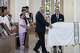 The casket of Marisol Pérez and Erik Pérez Jr., who died in a late May apartment fire, is wheeled past surviving family members including Erik and Vanessa Pérez during a funeral mass at St. Cecilia Catholic Church in Dallas, Tuesday, June 9, 2026.