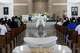 Rev. Cruz Calderon raises a chalice next to deacon Andres Larraza during a funeral mass at St. Cecilia Catholic Church for Marisol Pérez and Erik Pérez Jr. who died in a late May apartment fire in Dallas, Tuesday, June 9, 2026.