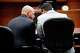 Attorney Leon Carter (left) and Dallas City Council member Adam Bazaldua confer before state District Judge Eric Moyé at the George L. Allen, Sr. Courts Building in Dallas in June. Three Dallas City Council members sued the city to delay a vote on the future of City Hall. That's no way to run a city, writes Joe Zylka.