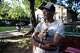 Lawrence Campell holds dog Butters in the front yard of his home in the Queen City neighborhood of Dallas, Tuesday, June 9, 2026.