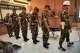 Indonesian service members, from second left, Sami Lakka, Nandala Dwi Prasetya, Budhi Hariyanto Widhi Cahyono, and Edi Sudarko who are accused of carrying an acid attack to human right activist Andrie Yunus, are escorted by military police persons as they leave after their sentencing hearing at a military court in Jakarta, Indonesia, Wednesday, June 10, 2026.