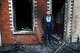 Jamie Corrie stands beside his burnt out house after rioting broke out late Tuesday, in east Belfast, Northern Ireland, Wednesday, June 10, 2026, following a stabbing incident.