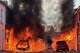 Vehicles set on fire by protesters burn on Lendrick Street in east Belfast, Northern Ireland, on Tuesday, June 9, 2026, after the arrest of a Sudanese man accused of stabbing a man in the northern part of the city. (PA via AP)