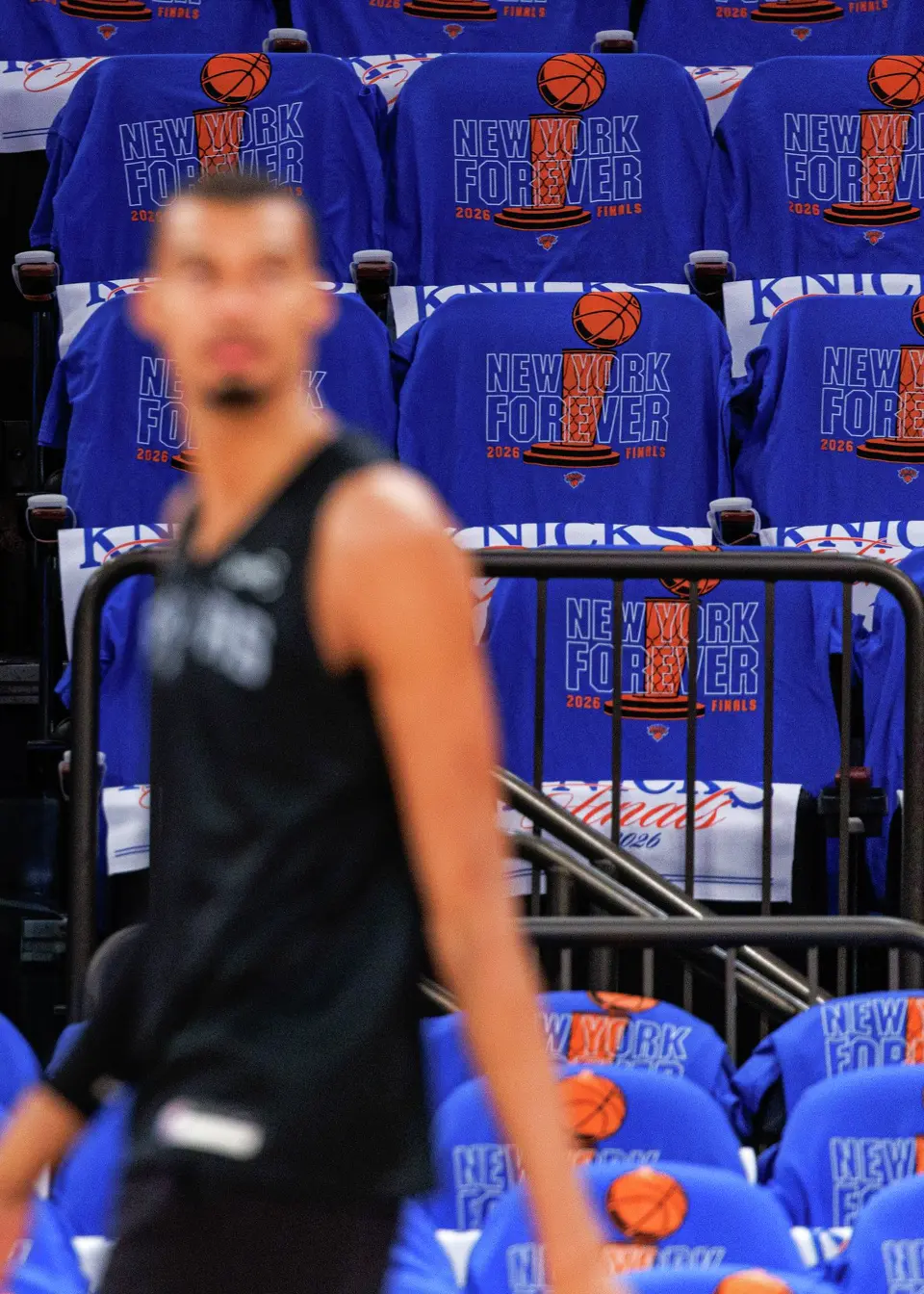 San Antonio Spurs center Victor Wembanyama walks past a row of t-shirts for New York Knicks fans during practice at Madison Square Garden in New York, Wednesday, June 10, 2026, ahead of Game 4 of the NBA Finals against the New York Knicks.