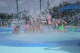 The English family gets soaked by the water bucket at the Leon Corlew Park & Splash Pad.