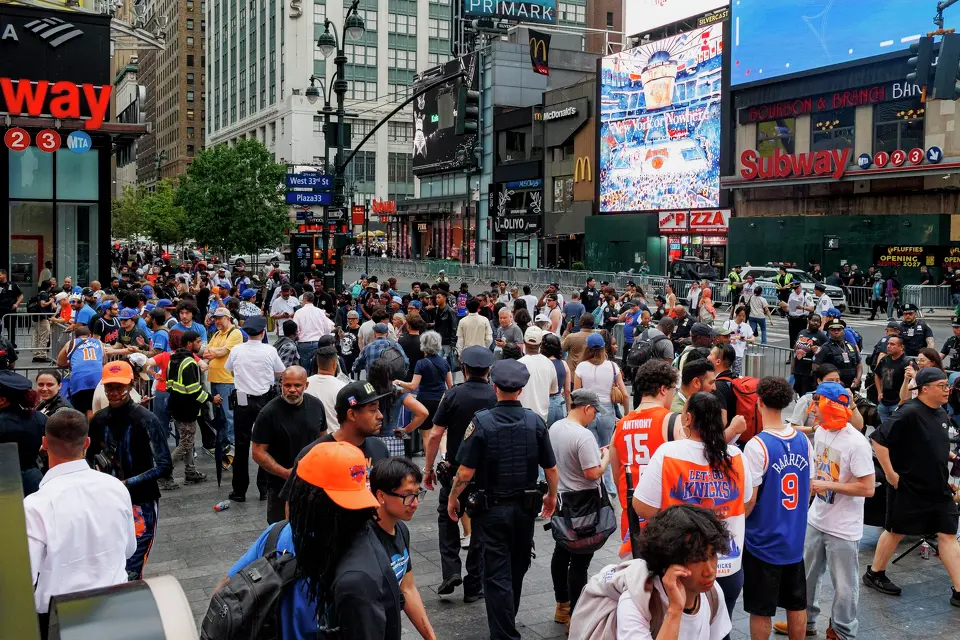 People walk near Madison Square Garden in New York, Wednesday, June 10, 2026, ahead of Game 4 of the NBA Finals against the New York Knicks.