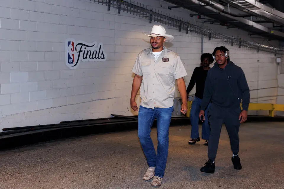 San Antonio Spurs players Keldon Johnson, front to back, Harrison Ingram and Emanuel Miller walk into Madison Square Garden in New York, Wednesday, June 10, 2026, before taking on the New York Knicks in Game 4 of the NBA Finals.