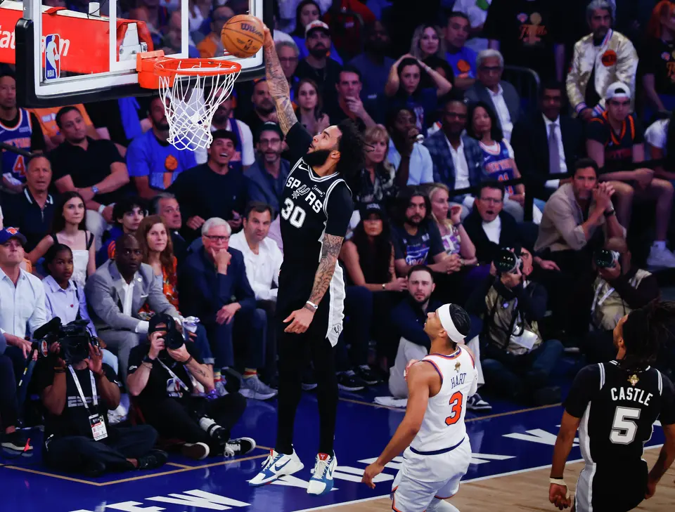 San Antonio Spurs forward Julian Champagnie (30) goes up to dunk the ball during the first quarter of Game 4 of the NBA Finals at Madison Square Garden in New York, Wednesday, June 10, 2026.