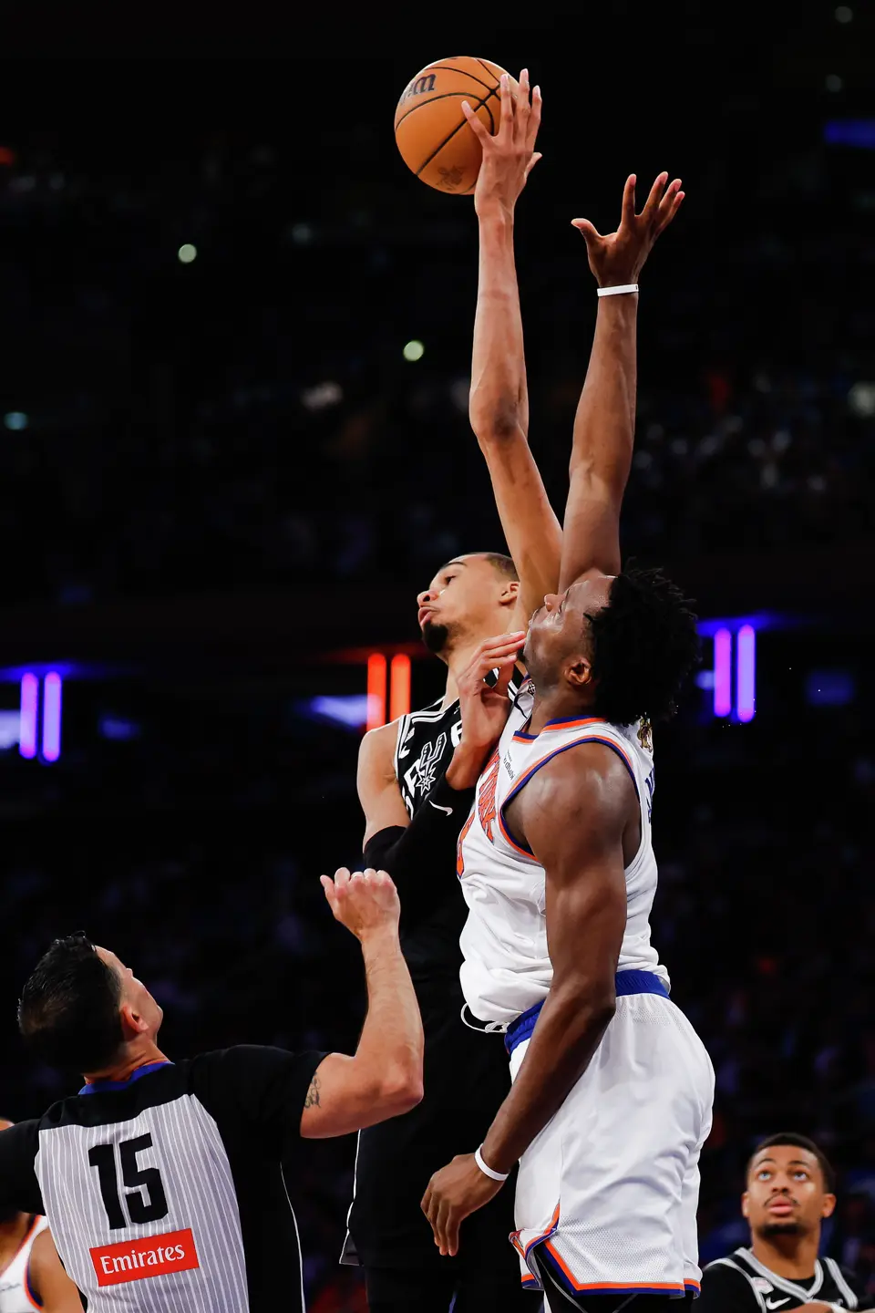 New York Knicks forward Og Anunoby (8) and San Antonio Spurs center Victor Wembanyama (1) go up for a jump ball during the second quarter of Game 4 of the NBA Finals at Madison Square Garden in New York, Wednesday, June 10, 2026.