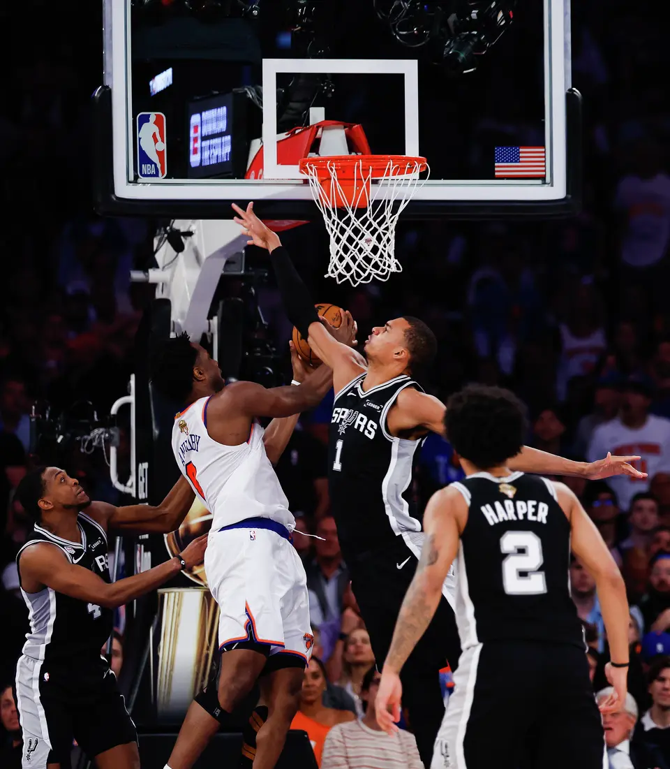San Antonio Spurs center Victor Wembanyama (1) jumps up to block a shot by New York Knicks forward Og Anunoby (8) during the second quarter of Game 4 of the NBA Finals at Madison Square Garden in New York, Wednesday, June 10, 2026.