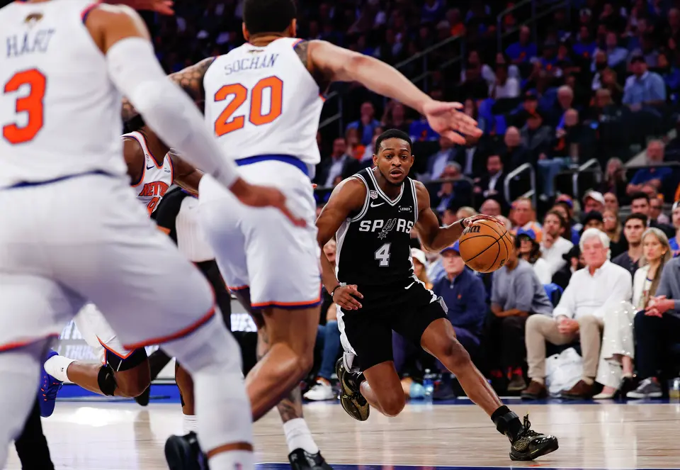 San Antonio Spurs guard De'Aaron Fox (4) drives the ball forward during the second quarter of Game 4 of the NBA Finals at Madison Square Garden in New York, Wednesday, June 10, 2026.
