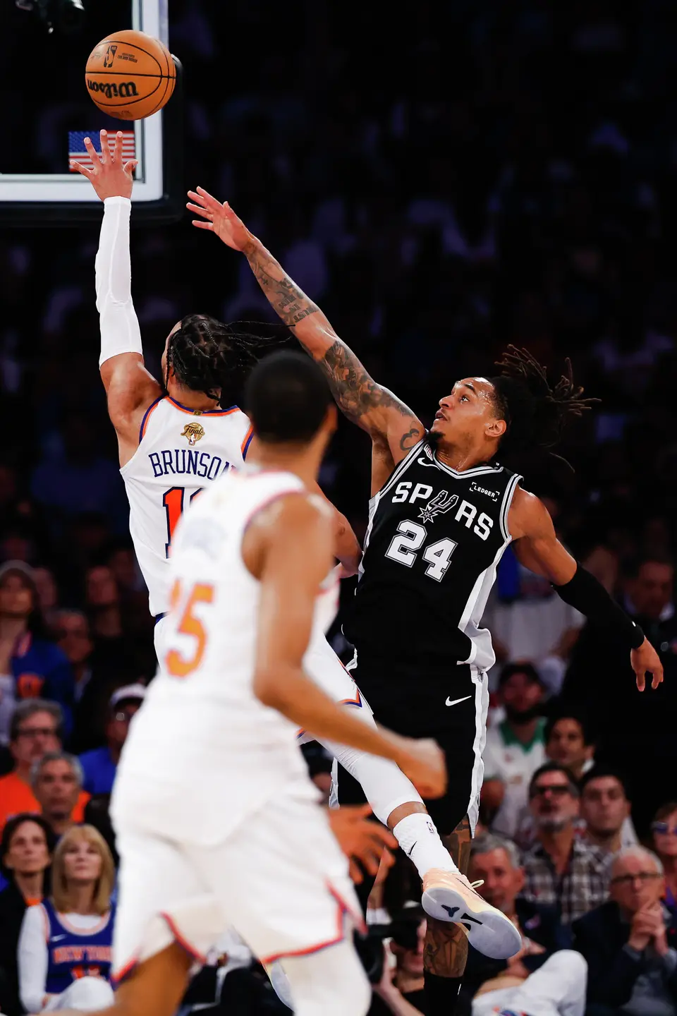 San Antonio Spurs guard Devin Vassell (24) attempts to block a shot by New York Knicks guard Jalen Brunson (11) during the second quarter of Game 4 of the NBA Finals at Madison Square Garden in New York, Wednesday, June 10, 2026.