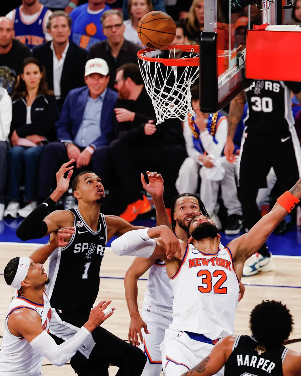San Antonio Spurs center Victor Wembanyama (1), New York Knicks center Karl-Anthony Towns (32), New York Knicks guard Jalen Brunson (11) and New York Knicks guard Josh Hart (3) watch the ball at the net during the third quarter of Game 4 of the NBA Finals at Madison Square Garden in New York, Wednesday, June 10, 2026.
