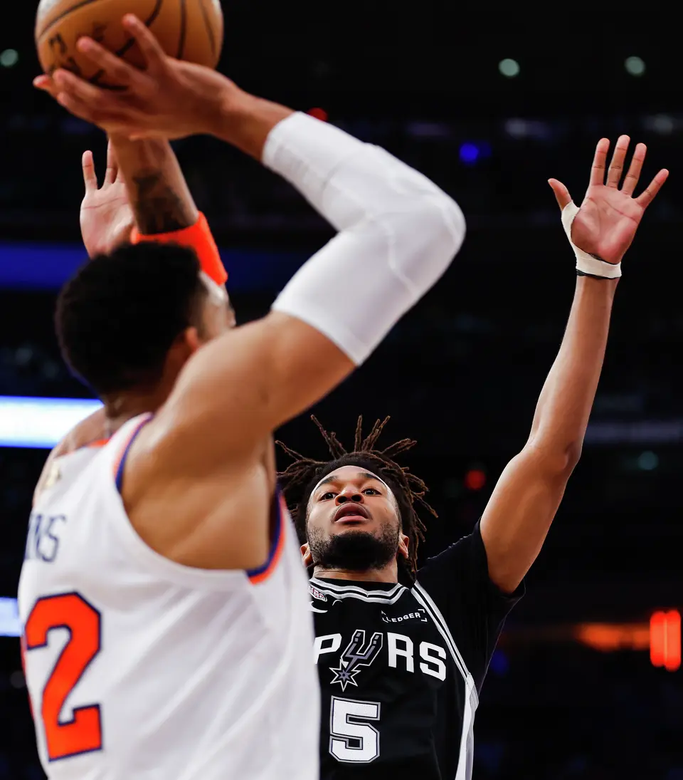 San Antonio Spurs guard Stephon Castle (5) defends New York Knicks center Karl-Anthony Towns (32) during the fourth quarter of Game 4 of the NBA Finals at Madison Square Garden in New York, Wednesday, June 10, 2026. The Knick defeated the Spurs 107-106, leading the series 3-1.