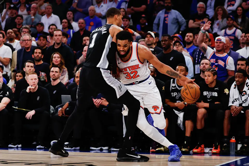 New York Knicks center Karl-Anthony Towns (32) drive the ball around San Antonio Spurs center Victor Wembanyama (1) during the fourth quarter of Game 4 of the NBA Finals at Madison Square Garden in New York, Wednesday, June 10, 2026. The Knick defeated the Spurs 107-106, leading the series 3-1.