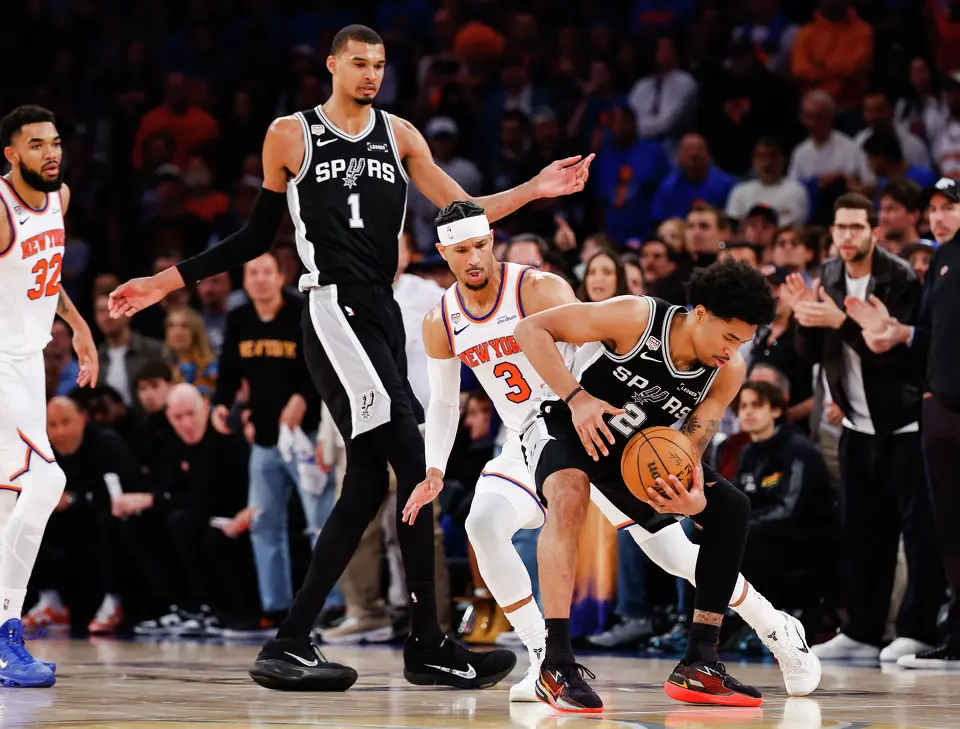 San Antonio Spurs guard Dylan Harper (2) tries to maneuver the ball around New York Knicks guard Josh Hart (3) during the fourth quarter of Game 4 of the NBA Finals at Madison Square Garden in New York, Wednesday, June 10, 2026. The Knick defeated the Spurs 107-106, leading the series 3-1.