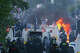 Police attempt to disperse protesters near Newtownabbey, in Belfast, Northern Ireland, Wednesday, June 10, 2026, following a stabbing incident on Monday night.