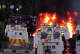 Police attempt to disperse protesters as a fire burns near Newtownabbey, in Belfast, Northern Ireland, Wednesday, June 10, 2026, following a stabbing incident on Monday night. (PA via AP)