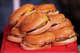 Cheeseburgers are seen in a pile during a burger eating contest for national cheeseburger day at P. Terry’s Burger Stand on Lamar Blvd in Austin, Thursday, Sept. 18, 2025. The chain is offering a big deal for the FIFA World Cup.