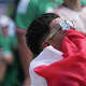 A Mexico fan wipes his eye with the country’s flag while Mexico faces South Africa during the FIFA World Cup 2026 Fan Festival as Mexico takes on South Africa in Houston, Thursday, June 11, 2026.in Houston, Thursday, June 11, 2026.