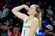 Dallas Wings guard Paige Bueckers flexes on the bench as she celebrates a basket by Li Yueru during the second half of a WNBA basketball game against the Phoenix Mercury at College Park Center on Thursday, June 11, 2026, in Arlington, Texas.