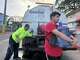 Bryan Pérez hauls a five-gallon water jug to his apartment in the Villa Kennedy public housing complex in San Juan, Puerto Rico, Wednesday, June 10, 2026.