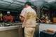 Uniforms are intentionally in a utility src, paying homage to blue-collar Mexican-American workers.
